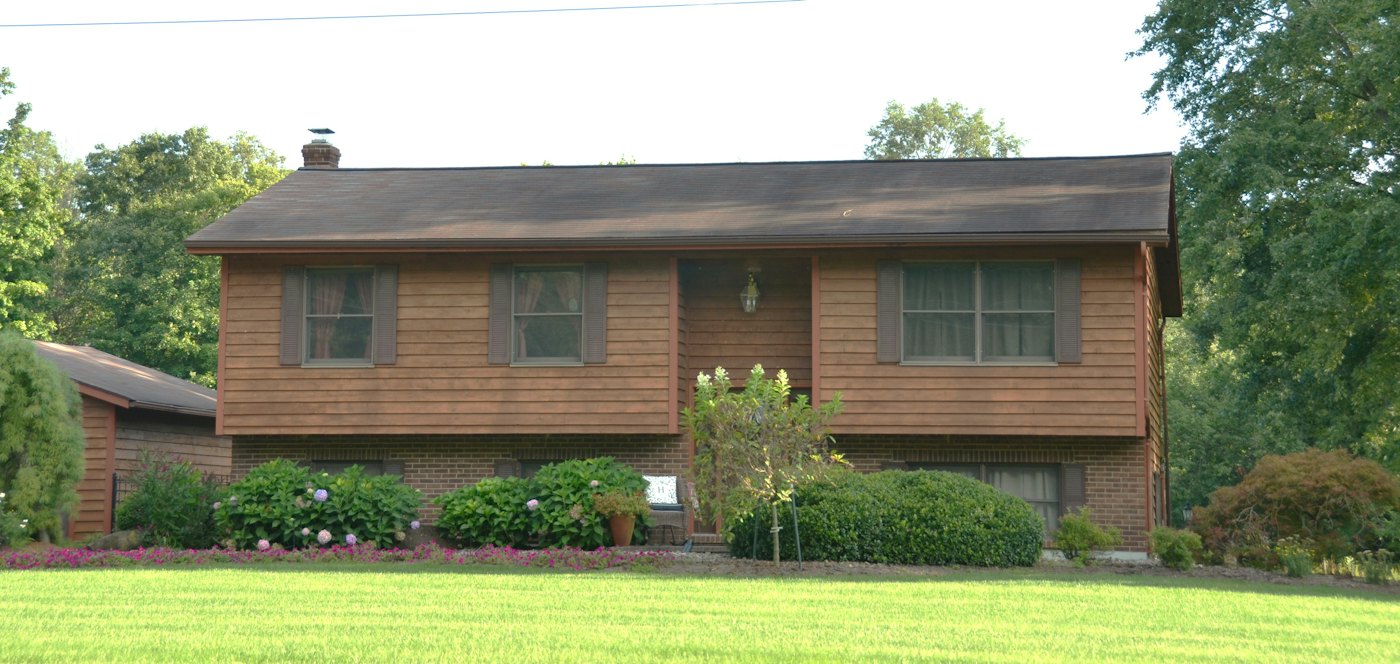 Raised ranch home with a lower level and landscaped front yard